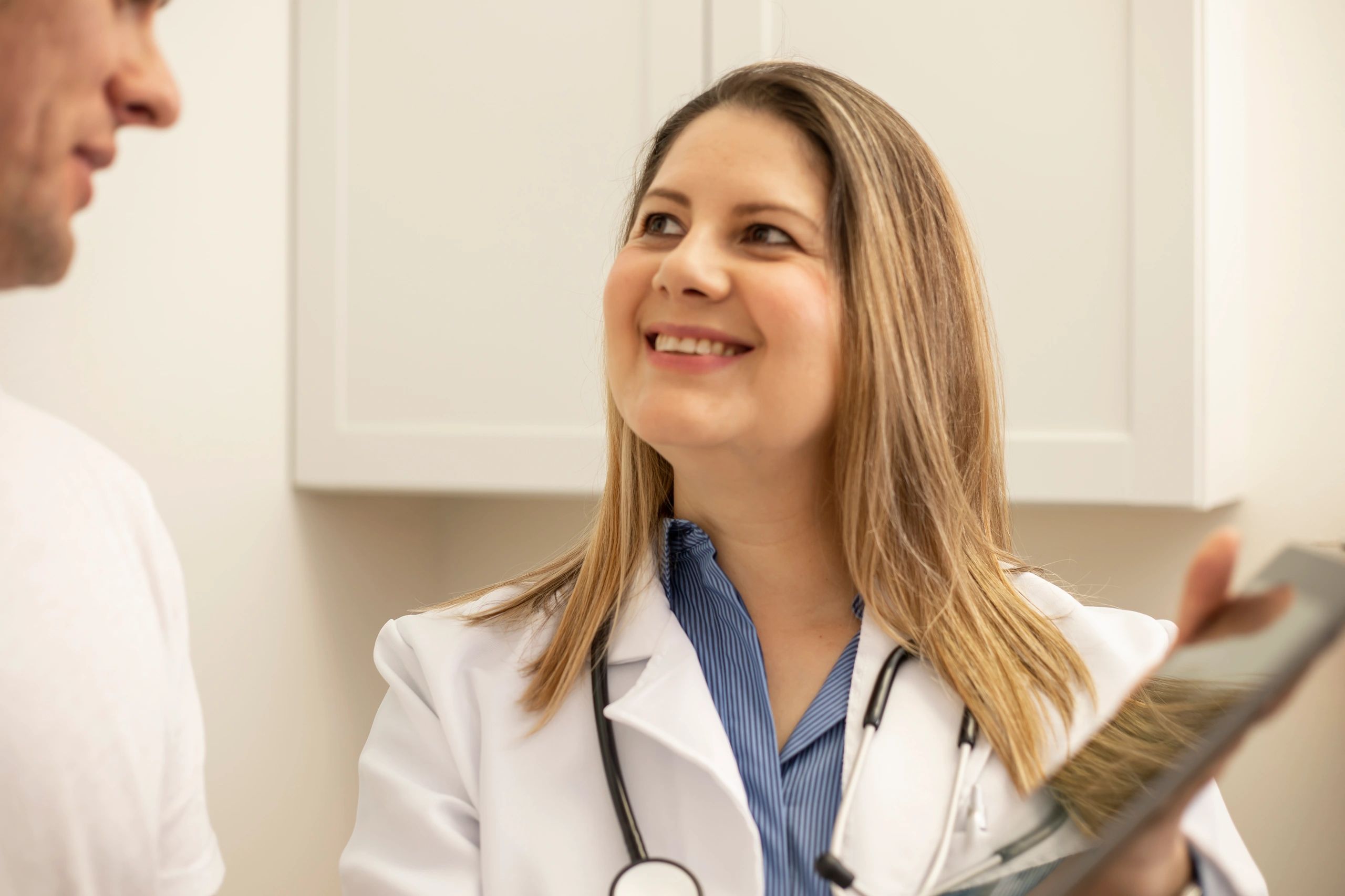 Healthcare professionals interacting with patients in a clinic setting