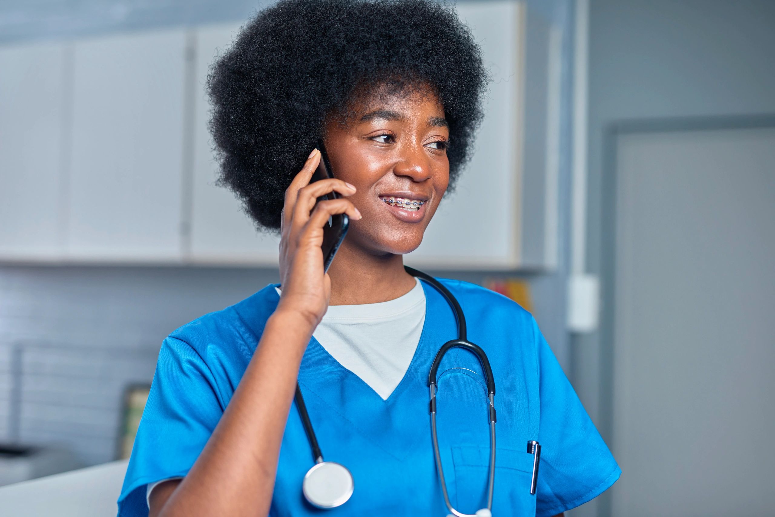 Healthcare professional smiling in a clinical setting