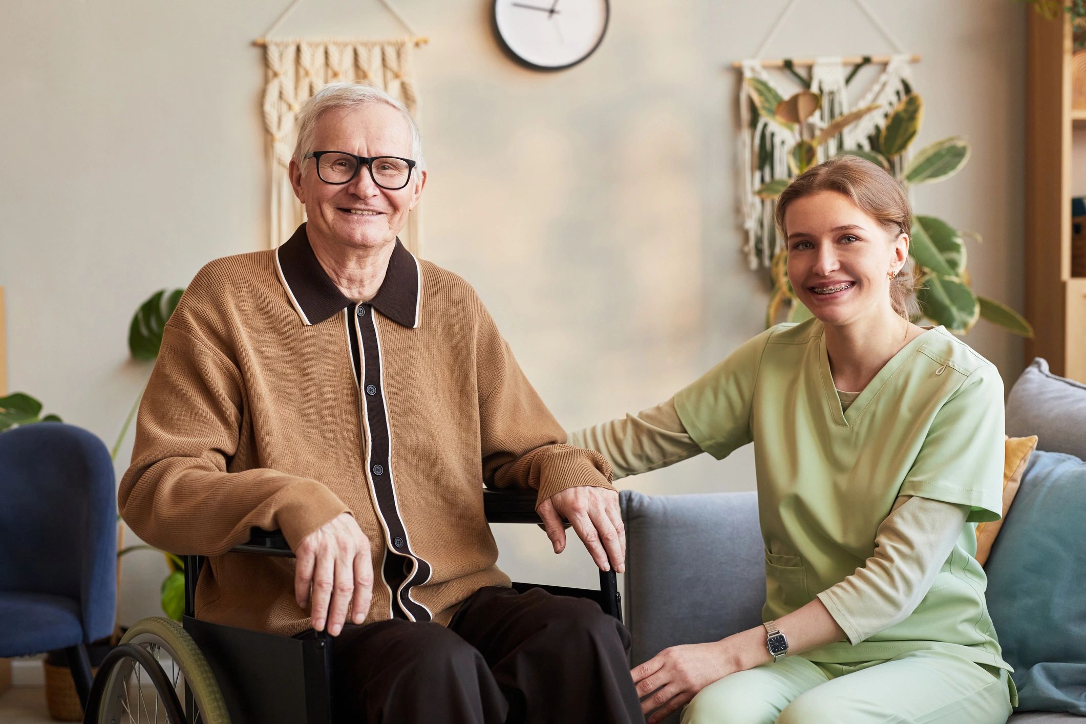 Senior patient with caregiver smiling together